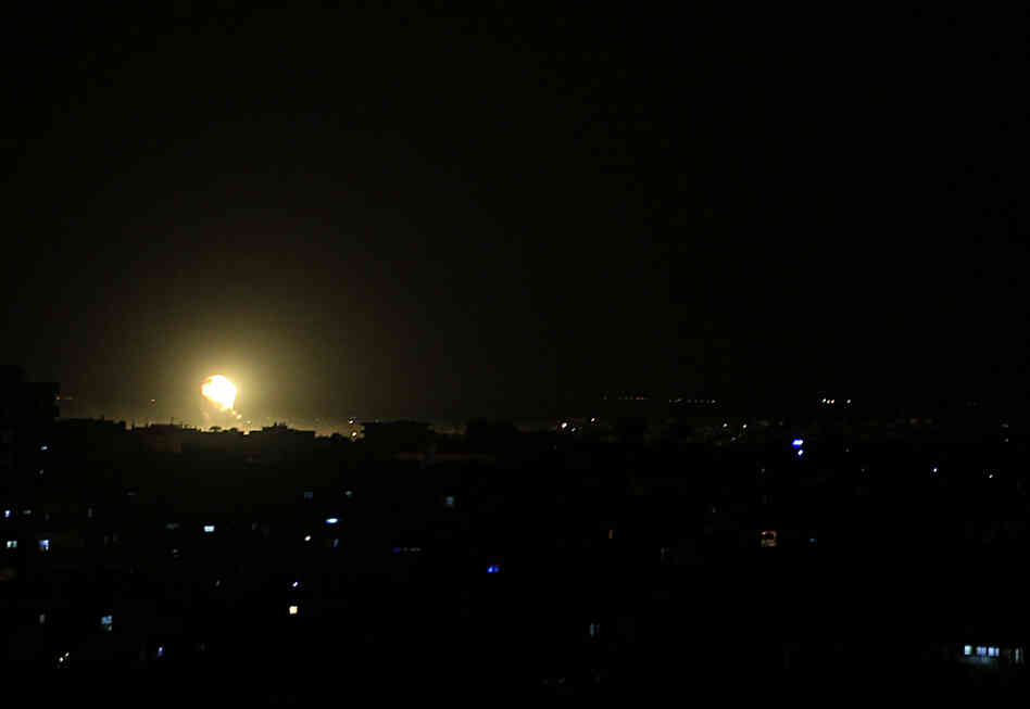Fire rises from a building during an explosion following an Israeli strike in the town of Rafah in the southern Gaza Strip on Friday.