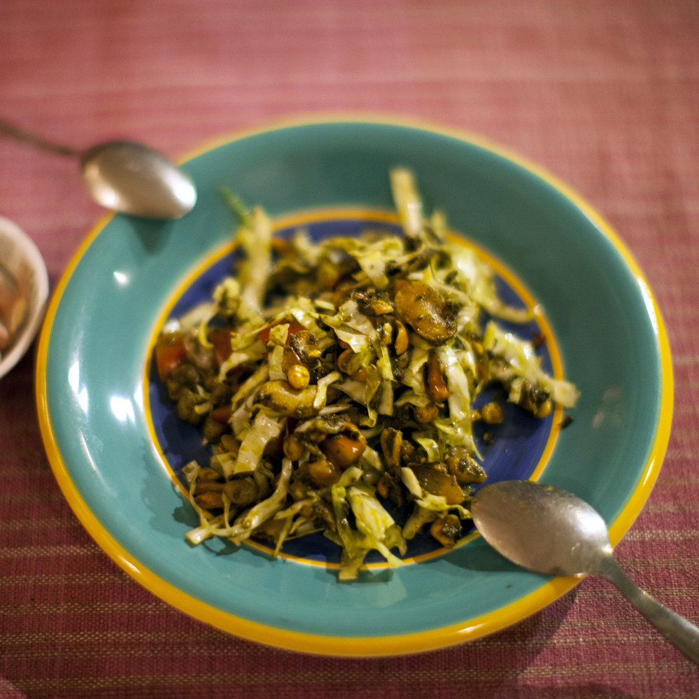 One of the restaurant's most popular dishes is the Burmese green tea leaf salad with crunchy fried nuts.