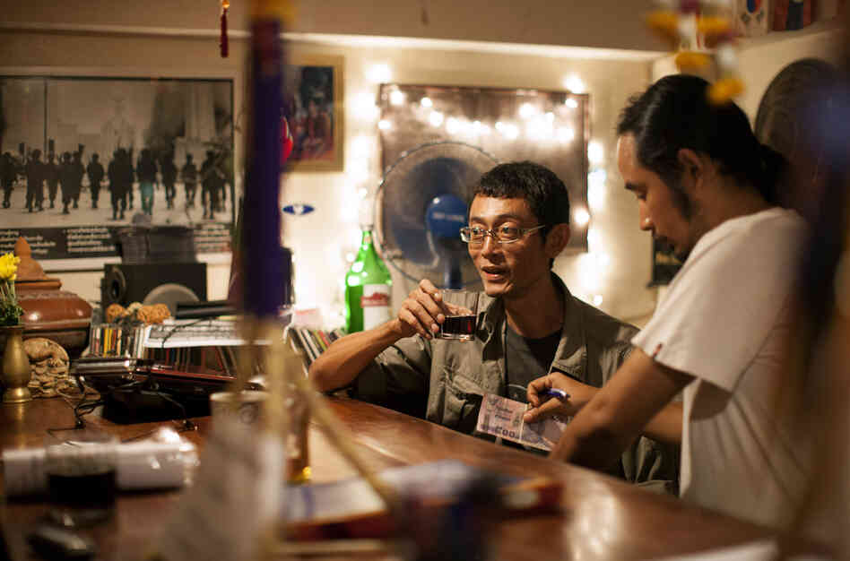 Myat Thu, who owns the Aiya restaurant, takes a break at the bar with his chef Ney Minn. They both grew up in the Burmese capital, Rangoon.