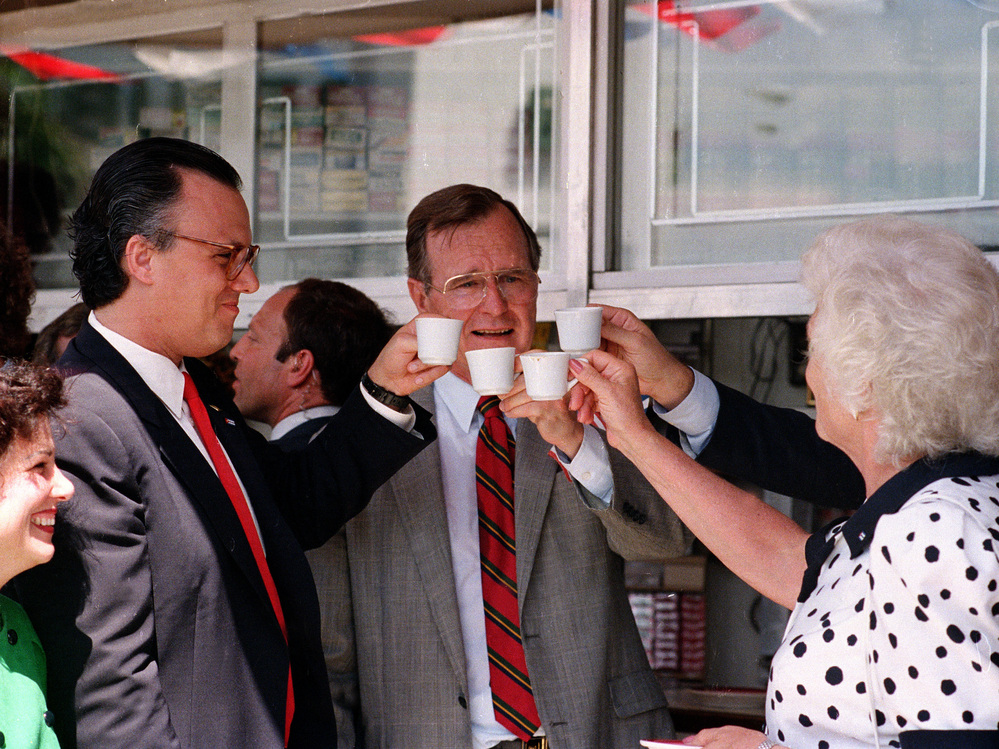 Vice President George H.W. Bush toasts with cups of Cuban coffee on June 17, 1987, in the Little Havana neighborhood of Miami. Bush, who was in Florida to raise funds for his bid for the Republican presidential nomination, stopped at the restaurant after ceremonies renaming a street in the neighborhood for President Reagan.