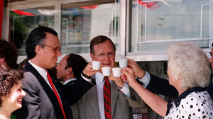 Vice President George H.W. Bush toasts with cups of Cuban coffee on June 17, 1987, in the Little Havana neighborhood of Miami. Bush, who was in Florida to raise funds for his bid for the Republican presidential nomination, stopped at the restaurant after ceremonies renaming a street in the neighborhood for President Reagan.