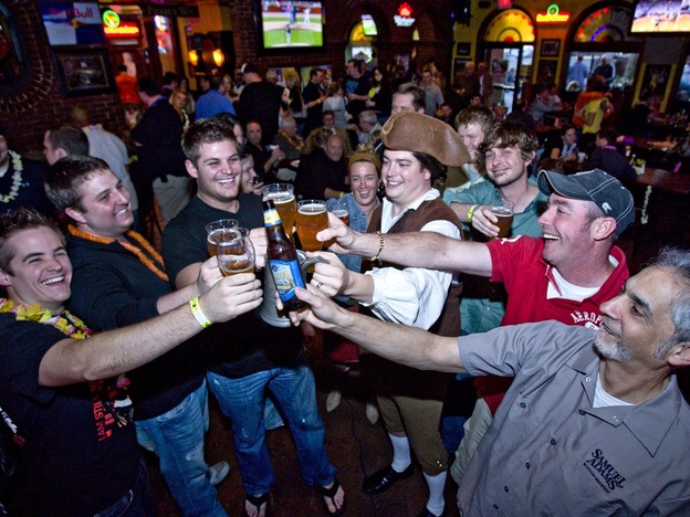 Not surprisingly, men like these guys cheering Sam Adams love beer. But more women than you might expect do too, according to a new study.
