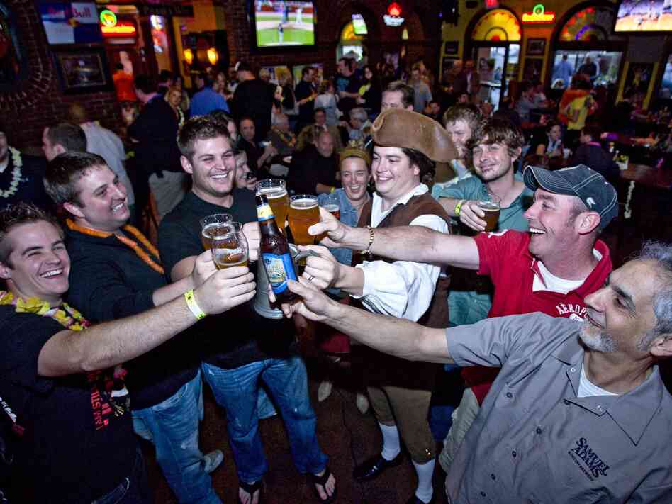 Not surprisingly, men like these guys cheering Sam Adams love beer. But more women than you might expect do too, according to a new study.