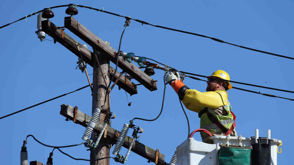 A worker repairs electrical lines as Long Islanders continue their cleanup efforts in the aftermath of Superstorm Sandy in Plainview, N.Y. A worker repairs electrical lines as Long Islanders continue their cleanup efforts in the aftermath of Superstorm Sandy in Plainview, N.Y.