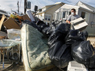 Ernest Shallo, of Carteret, N.J., throws a ruined air conditioner onto a pile of debris in front of a small home in Seaside Heights, N.J. Residents were allowed back in their homes for a few hours Monday, two weeks after the region was pounded by Superstorm Sandy. Ernest Shallo, of Carteret, N.J., throws a ruined air conditioner onto a pile of debris in front of a small home in Seaside Heights, N.J. Residents were allowed back in their homes for a few hours Monday, two weeks after the region was pounded by Superstorm Sandy.