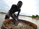 A diamond prospector filters earth from a river in Koidu, the capital of diamond-rich Kono district in eastern Sierra Leone. Koidu suffered some of the worst ravages of Sierra Leone's war in the 1990s as rebels forced citizens to mine at gunpoint. Ten years after the conflict, diamonds remain a contentious issue. A diamond prospector filters earth from a river in Koidu, the capital of diamond-rich Kono district in eastern Sierra Leone. Koidu suffered some of the worst ravages of Sierra Leone's war in the 1990s as rebels forced citizens to mine at gunpoint. Ten years after the conflict, diamonds remain a contentious issue.