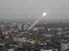 Rockets lunched by Palestinian militants toward Israel make their way from the northern Gaza Strip on Saturday.