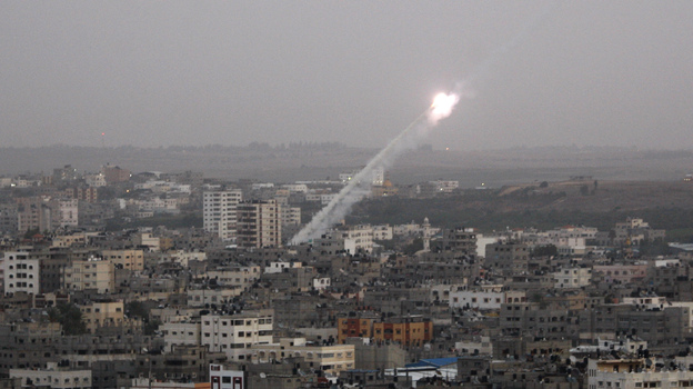 Rockets lunched by Palestinian militants toward Israel make their way from the northern Gaza Strip on Saturday.
