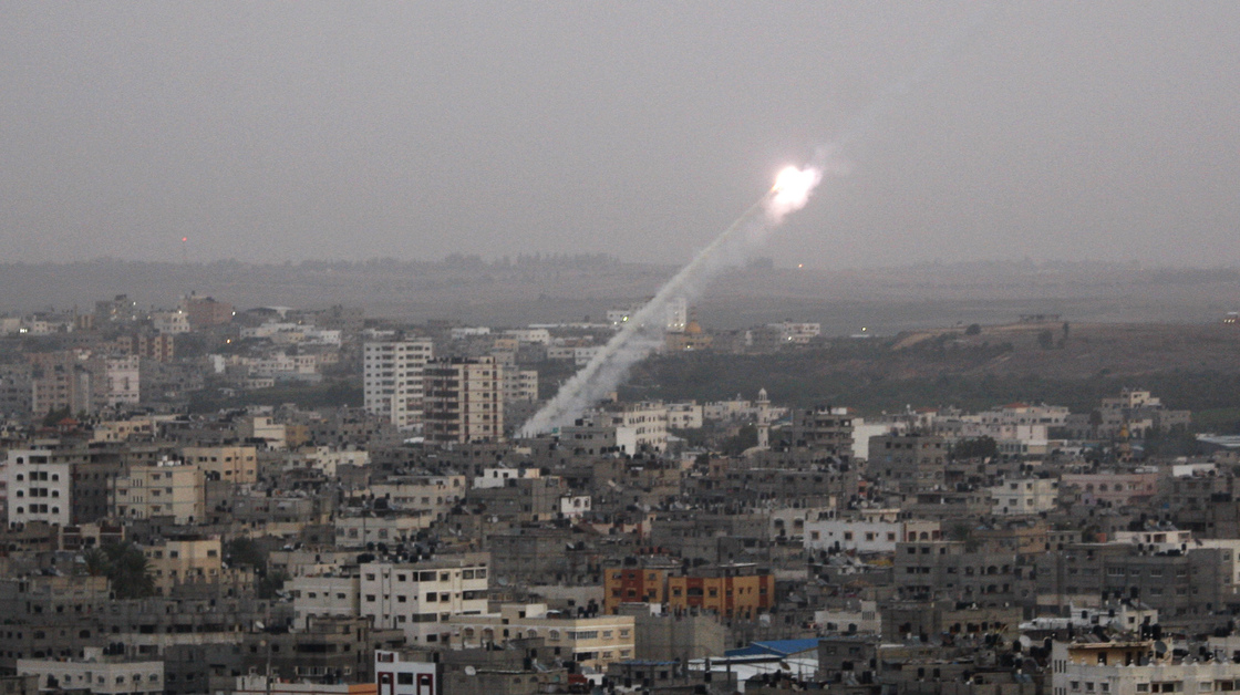 Rockets lunched by Palestinian militants toward Israel make their way from the northern Gaza Strip on Saturday.
