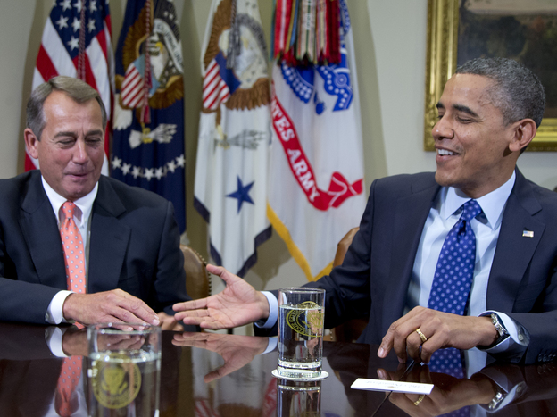 President Obama reaches to shake hands with House Speaker John Boehner, during a meeting Friday at the White House to discuss the deficit and economy.