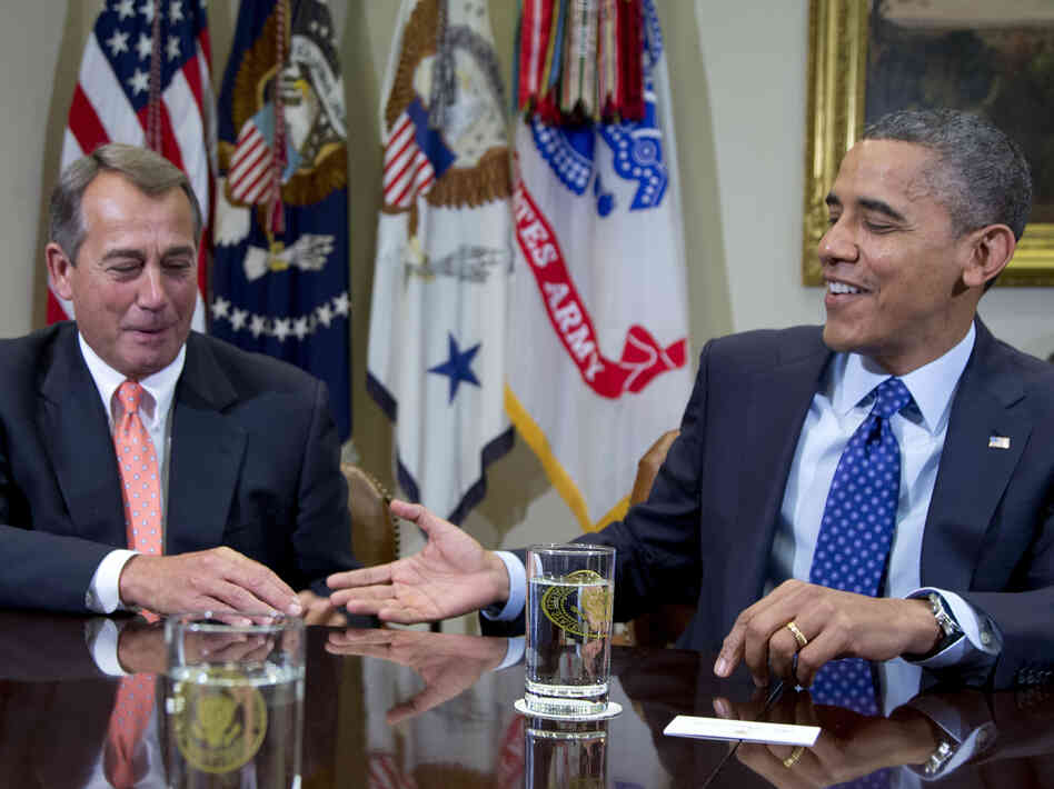President Obama reaches to shake hands with House Speaker John Boehner, during a meeting Friday at the White House to discuss the deficit and economy.
