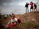 Israeli civilians in Tel Aviv run for cover during a rocket attack launched from Gaza on Saturday. Israeli civilians in Tel Aviv run for cover during a rocket attack launched from Gaza on Saturday.