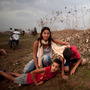 Israeli civilians in Tel Aviv run for cover during a rocket attack launched from Gaza on Saturday.