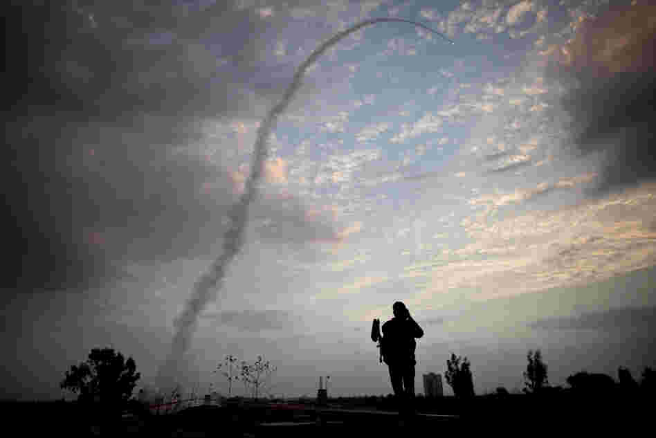 A missile from Israel's Iron Dome defense system launches to intercept and destroy incoming rocket fire from Gaza in Tel Aviv on Saturday.