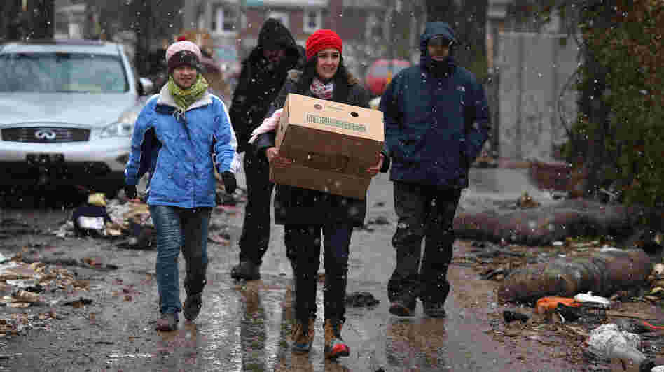 Volunteers bring food to residents of homes damaged by Superstorm Sandy earlier this month in the Staten Island borough of New York City.