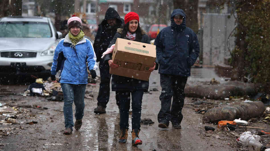Volunteers bring food to residents of homes damaged by Superstorm Sandy earlier this month in the Staten Island borough of New York City.