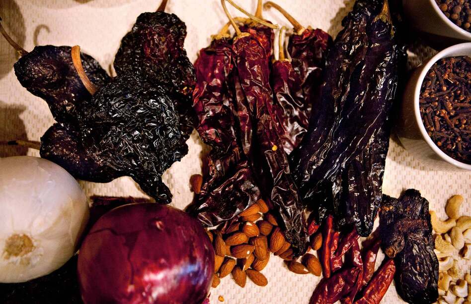 The main ingredient in mole is dried chili peppers; to prepare them for cooking, one must remove the seeds, toast the seeds with tortillas, then rinse the seeds, then roast the skins, rehydrate them and finally blend and cook them together with all the other ingredients. The main ingredient in mole is dried chili peppers; to prepare them for cooking, one must remove the seeds, toast the seeds with tortillas, then rinse the seeds, then roast the skins, rehydrate them and finally blend and cook them together with all the other ingredients.