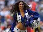 A Dallas Cowboys cheerleader performs at Cowboys Stadium.