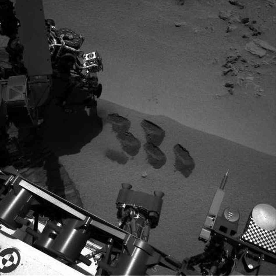 NASA's Mars rover Curiosity dug up five scoops of sand from a patch nicknamed "Rocknest." A suite of instruments called SAM analyzed Martian soil samples, but the findings have not yet been released. NASA's Mars rover Curiosity dug up five scoops of sand from a patch nicknamed "Rocknest." A suite of instruments called SAM analyzed Martian soil samples, but the findings have not yet been released.