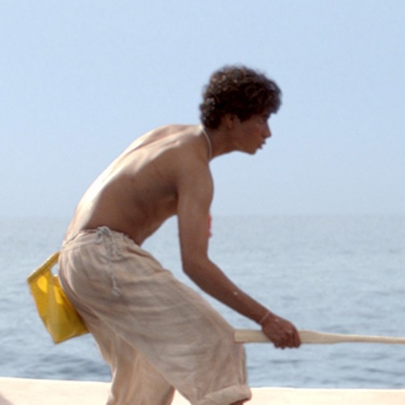 Pi Patel (Suraj Sharma) is lost at sea with a fierce Bengal tiger, Richard Parker.