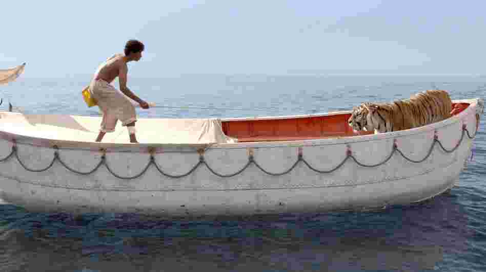 Pi Patel (Suraj Sharma) is lost at sea with a fierce Bengal tiger, Richard Parker. Pi Patel (Suraj Sharma) is lost at sea with a fierce Bengal tiger, Richard Parker.
