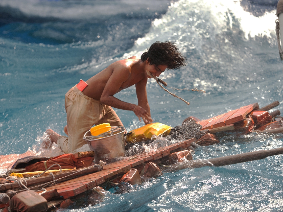 As a teenager, Pi (the younger version played here by Suraj Sharma) is lost at sea with a Bengal tiger.