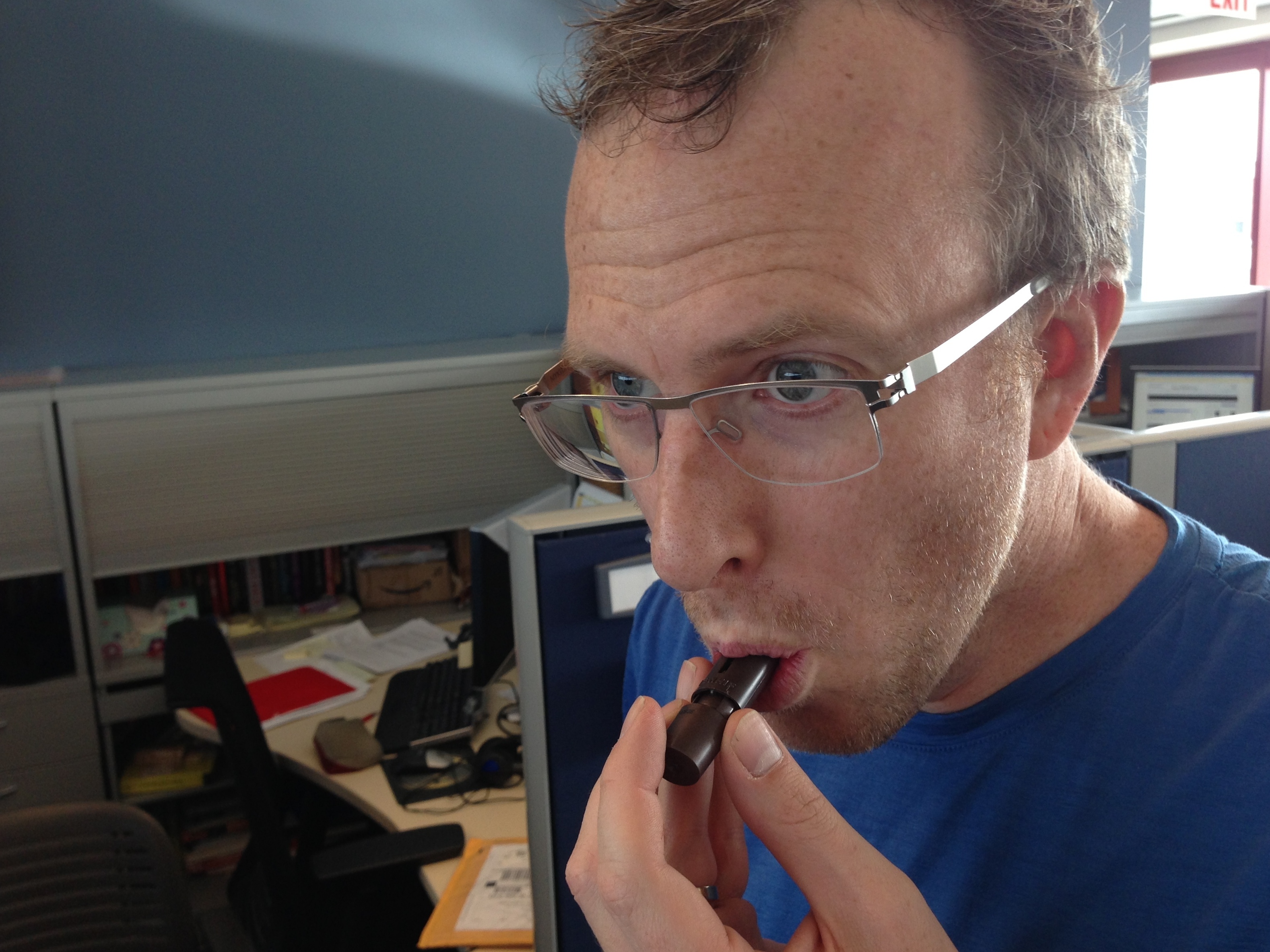 Mike: inhaling chocolate or playing a tiny flute?
