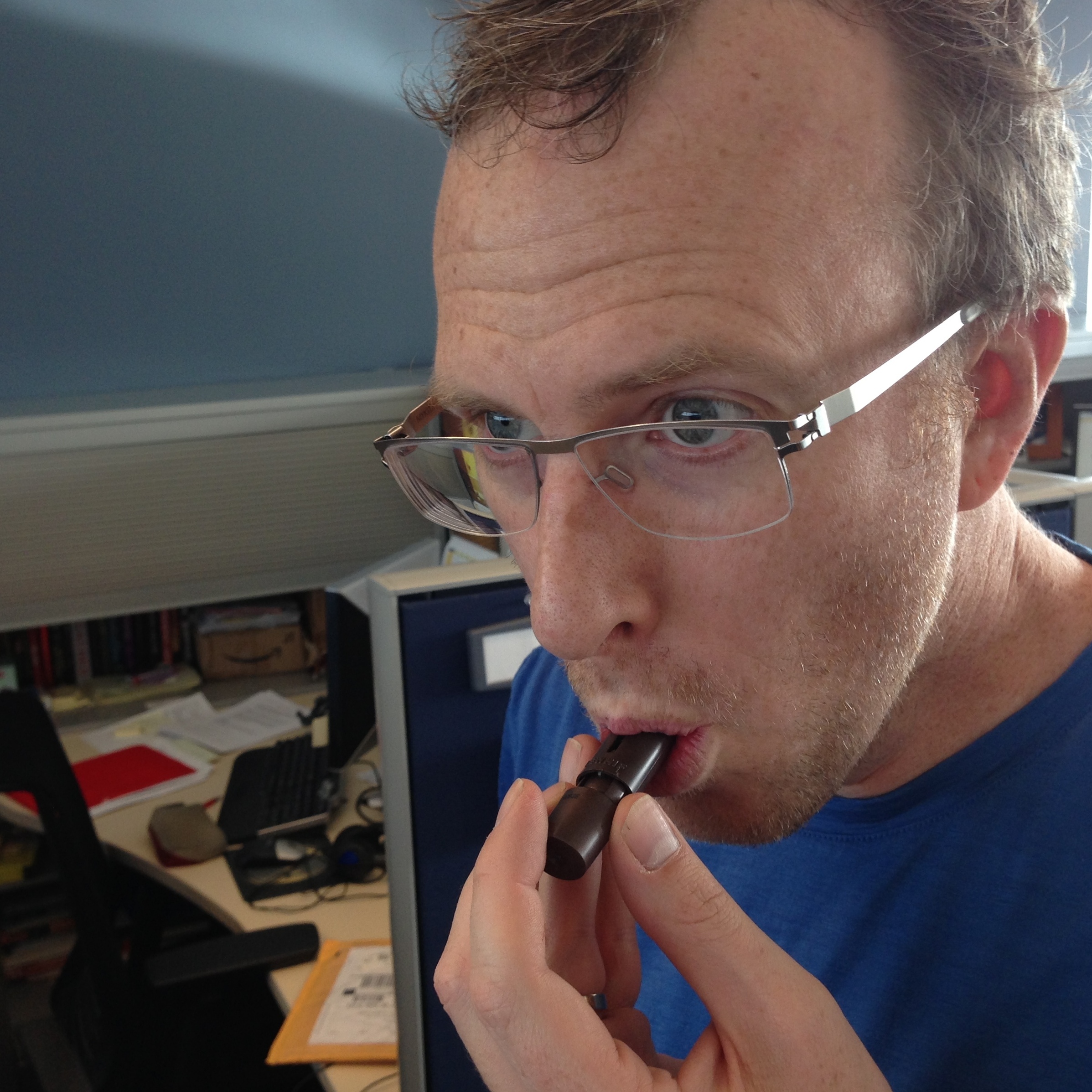 Mike: inhaling chocolate or playing a tiny flute?