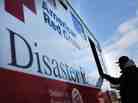 People receive free food from the American Red Cross in the heavily damaged Rockaway neighborhood on Nov. 14, 2012 in the Queens borough of New York City.