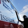 People receive free food from the American Red Cross in the heavily damaged Rockaway neighborhood on Nov. 14, 2012 in the Queens borough of New York City.