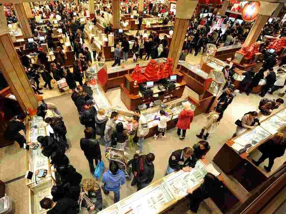 People crowd the aisles inside Macy's department store Nov. 25, 2011, in New York after the midnight opening to begin the "Black Friday" shopping weekend.