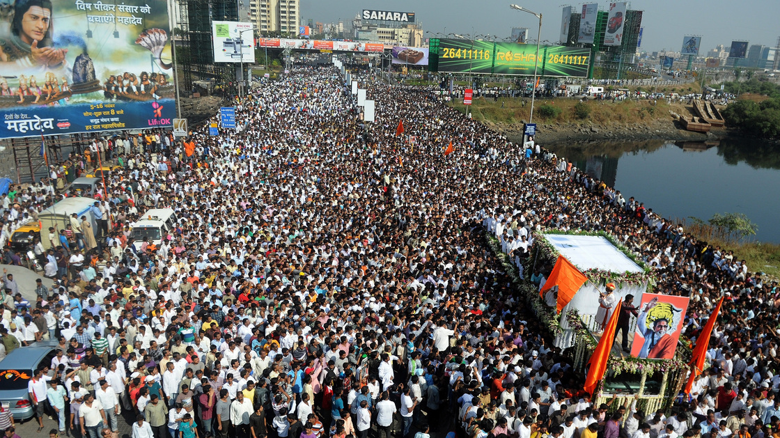 Bal Thackeray's funeral cortege made its way through a sea of supporters in Mumbai on Sunday.