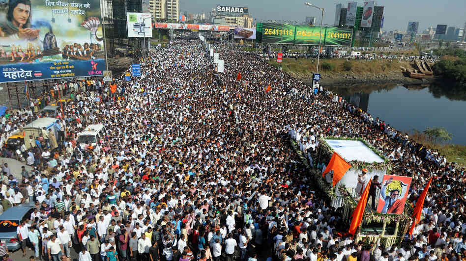 Bal Thackeray's funeral cortege made its way through a sea of supporters in Mumbai on Sunday.