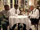 Antoine Batiste (Wendell Pierce) and his student Robert (Jaron Williams) take a minute with trumpeter Lionel Ferbos, playing himself, at the Palm Court Jazz Cafe. Antoine Batiste (Wendell Pierce) and his student Robert (Jaron Williams) take a minute with trumpeter Lionel Ferbos, playing himself, at the Palm Court Jazz Cafe.