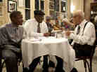 Antoine Batiste (Wendell Pierce) and his student Robert (Jaron Williams) take a minute with trumpeter Lionel Ferbos, playing himself, at the Palm Court Jazz Cafe.