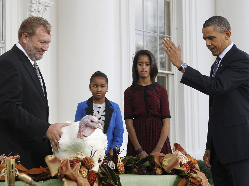 President Obama, with daughters Sasha and Malia, at last year's turkey pardoning ceremony.