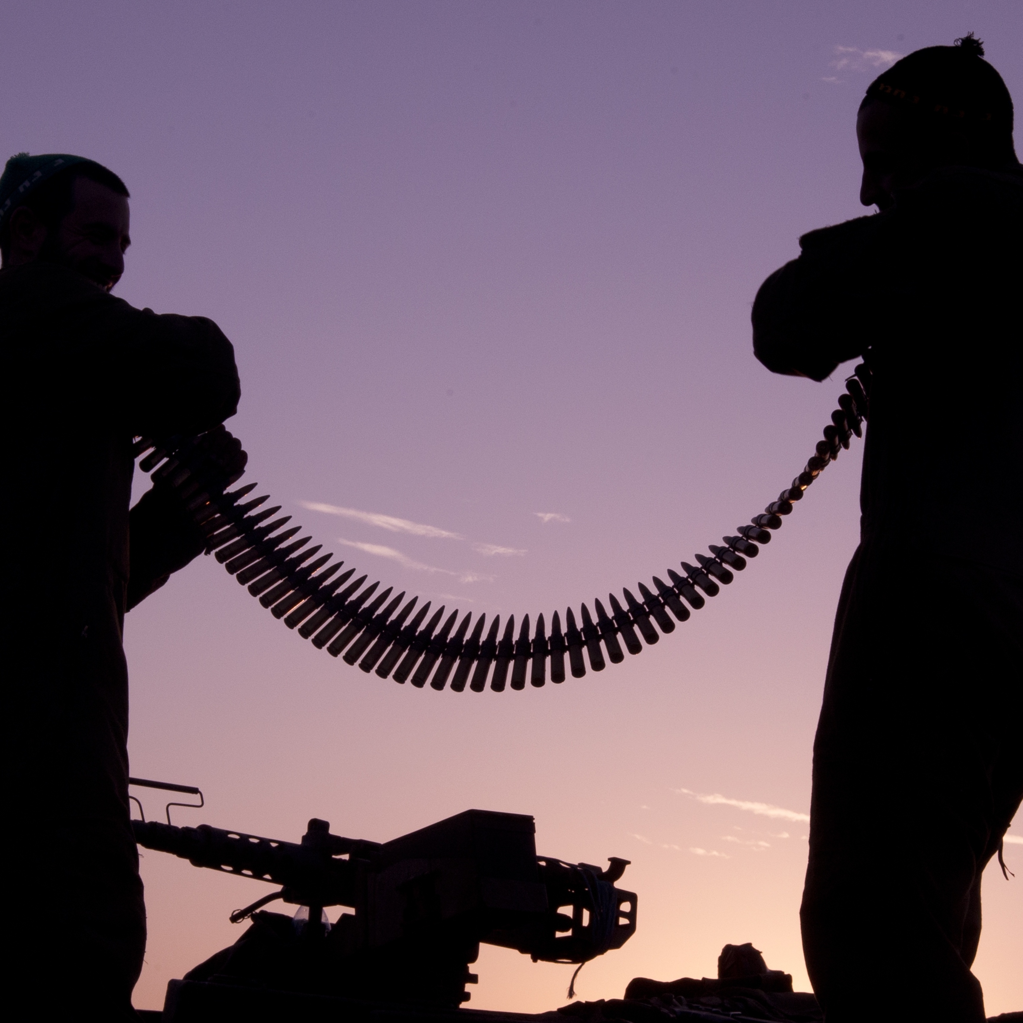 Israeli soldiers inspect an ammunition belt earlier today near the Israel-Gaza Strip border.