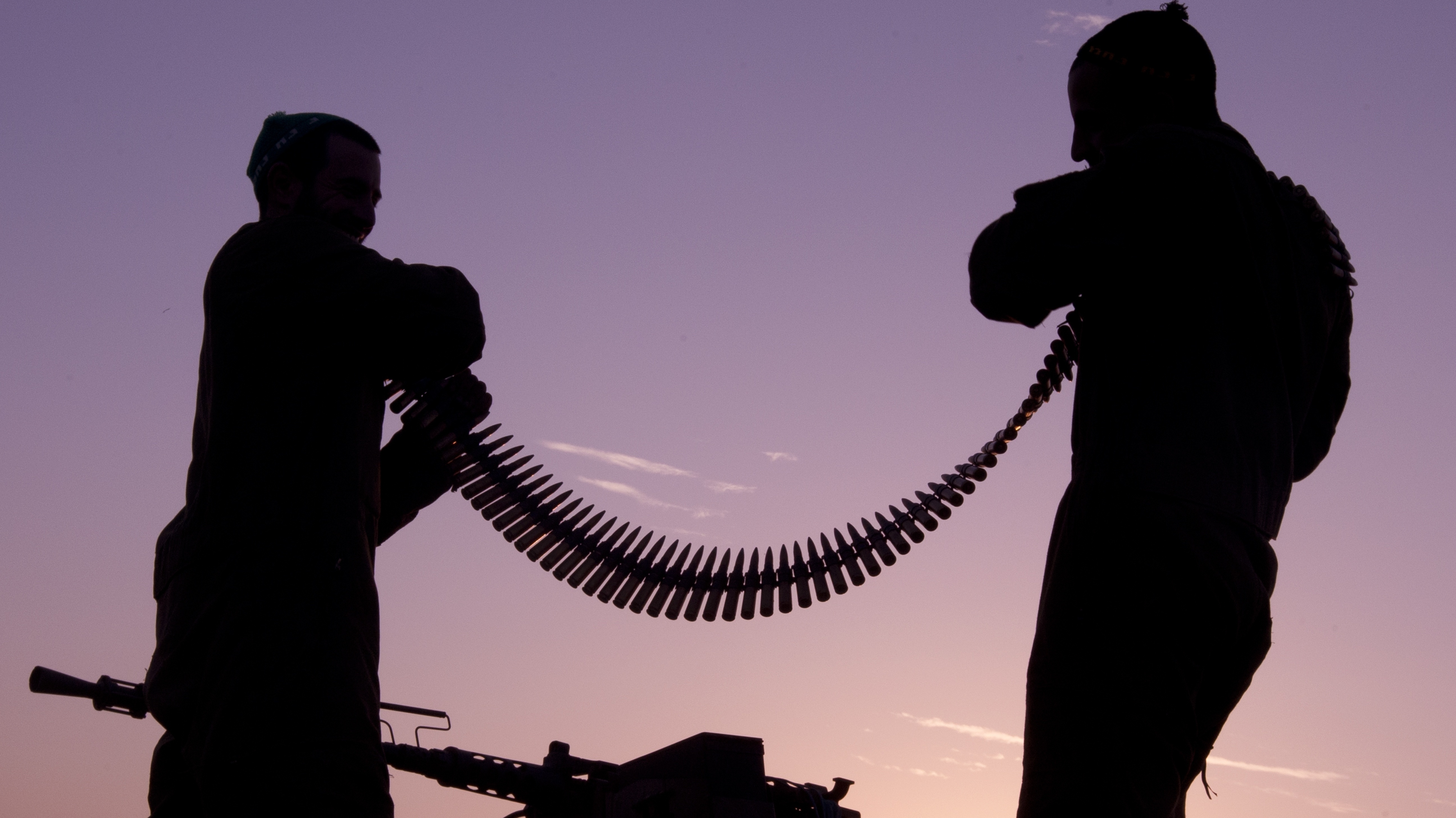 Israeli soldiers inspect an ammunition belt earlier today near the Israel-Gaza Strip border. Israeli soldiers inspect an ammunition belt earlier today near the Israel-Gaza Strip border.