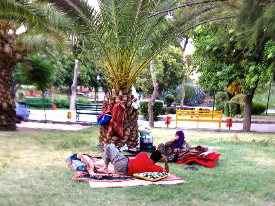 Syrians whose homes have been destroyed by recent shelling sleep in a Damascus park.