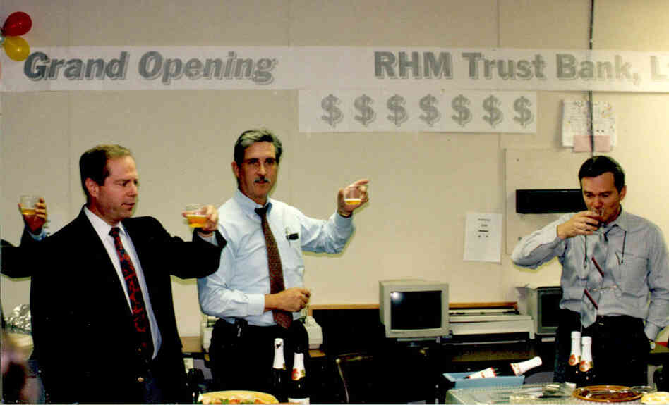 Special agents celebrate their fake offshore bank with apple juice. Special agents celebrate their fake offshore bank with apple juice.