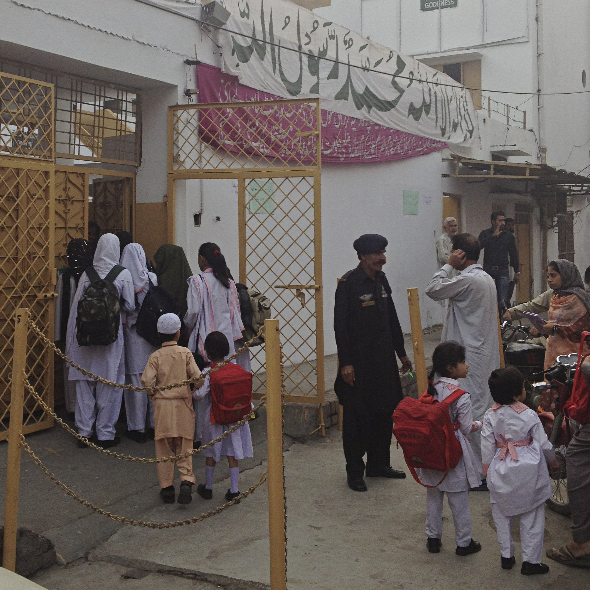 Students file into Lahore's reopened Farooqi Girls High School. The school was temporarily closed after a violent attack in October.