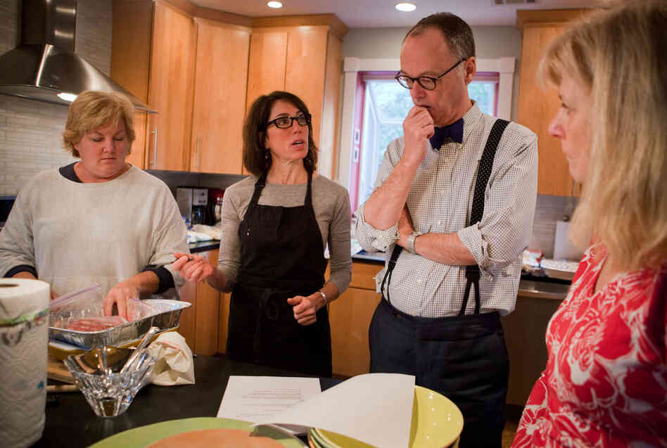 It takes a village to make a Thanksgiving radio segment. From left, assistant Carolyn Robb Schimley, Cherkasky, Kimball and publicist Deb Broide go over the plan for creating a Julia Child Thanksgiving on the radio.