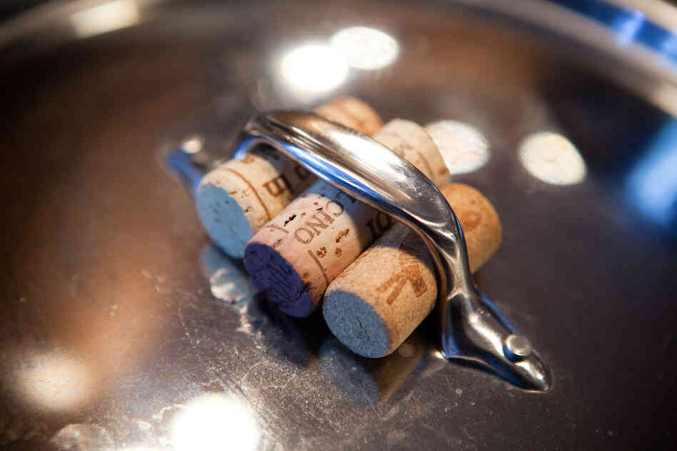 Kitchen tip: Corks make a great handle if you don't want to mess with potholders or dishtowels.