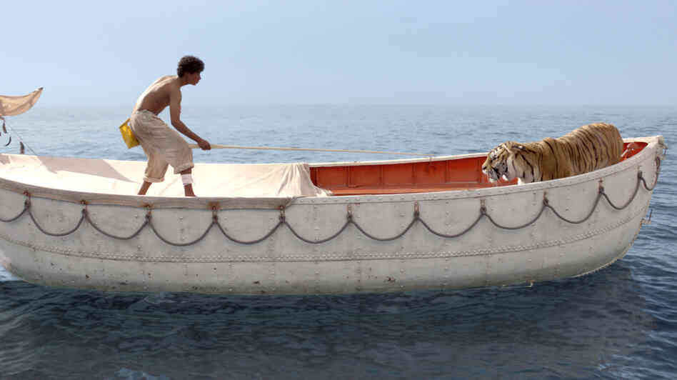 Pi Patel, played by Suraj Sharma, begins forging a connection with the fierce Bengal tiger named Richard Parker. Pi Patel, played by Suraj Sharma, begins forging a connection with the fierce Bengal tiger named Richard Parker.