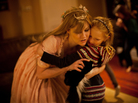 Mary Alice LeGrow, otherwise known as "Princess Marty," hugs a young girl during a birthday party in a Philadelphia suburb. A graphic artist and "cosplay" (costume play) fanatic, LeGrow became a full-time professional party princess to make ends meet during the economic downturn. Mary Alice LeGrow, otherwise known as "Princess Marty," hugs a young girl during a birthday party in a Philadelphia suburb. A graphic artist and "cosplay" (costume play) fanatic, LeGrow became a full-time professional party princess to make ends meet during the economic downturn.