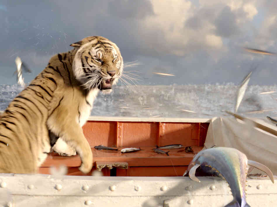 Richard Parker reacts to a school of flying fish.