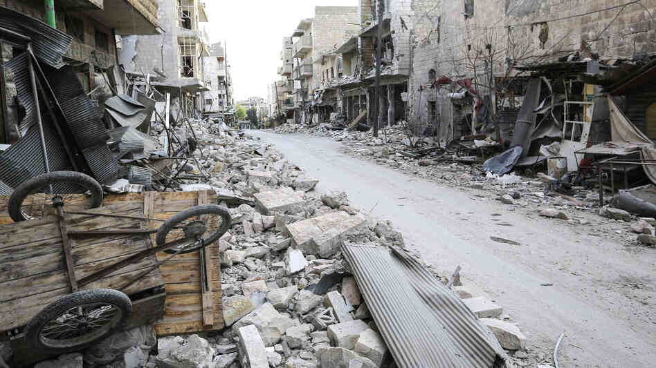 Rubble litters the street in the main souk or market area of Maraat al-Numan, Syria.