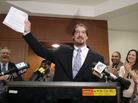 Greg Taylor holds up his release papers after he was unanimously exonerated by a three-judge panel in Raleigh, N.C., in 2010. Taylor, who had been in prison since 1993 for murder, is now suing several people who worked at a crime lab, claiming their erroneous findings landed him in jail. Greg Taylor holds up his release papers after he was unanimously exonerated by a three-judge panel in Raleigh, N.C., in 2010. Taylor, who had been in prison since 1993 for murder, is now suing several people who worked at a crime lab, claiming their erroneous findings landed him in jail.