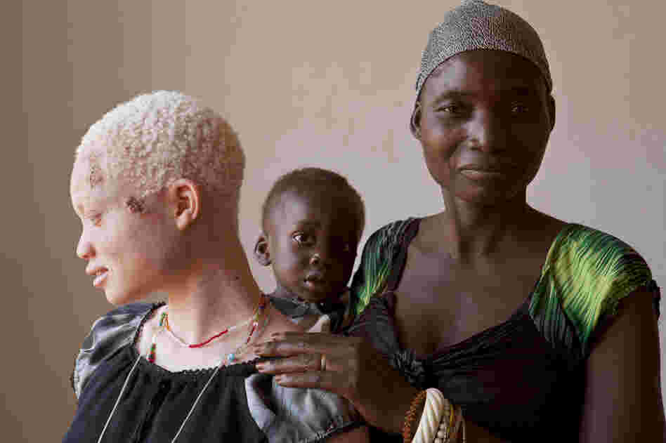 Salvatory, with her half-brother Ezekiel, 1, and mother Bestida, whom she had not seen in the four years she has lived away from home. She moved to the center after her own father led a group of men to attack her.