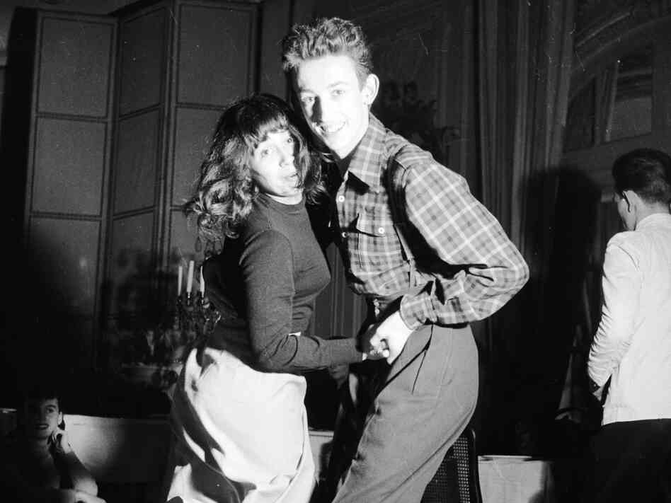 Baseball-booted students jitterbugging at the Carrere night club in Paris.